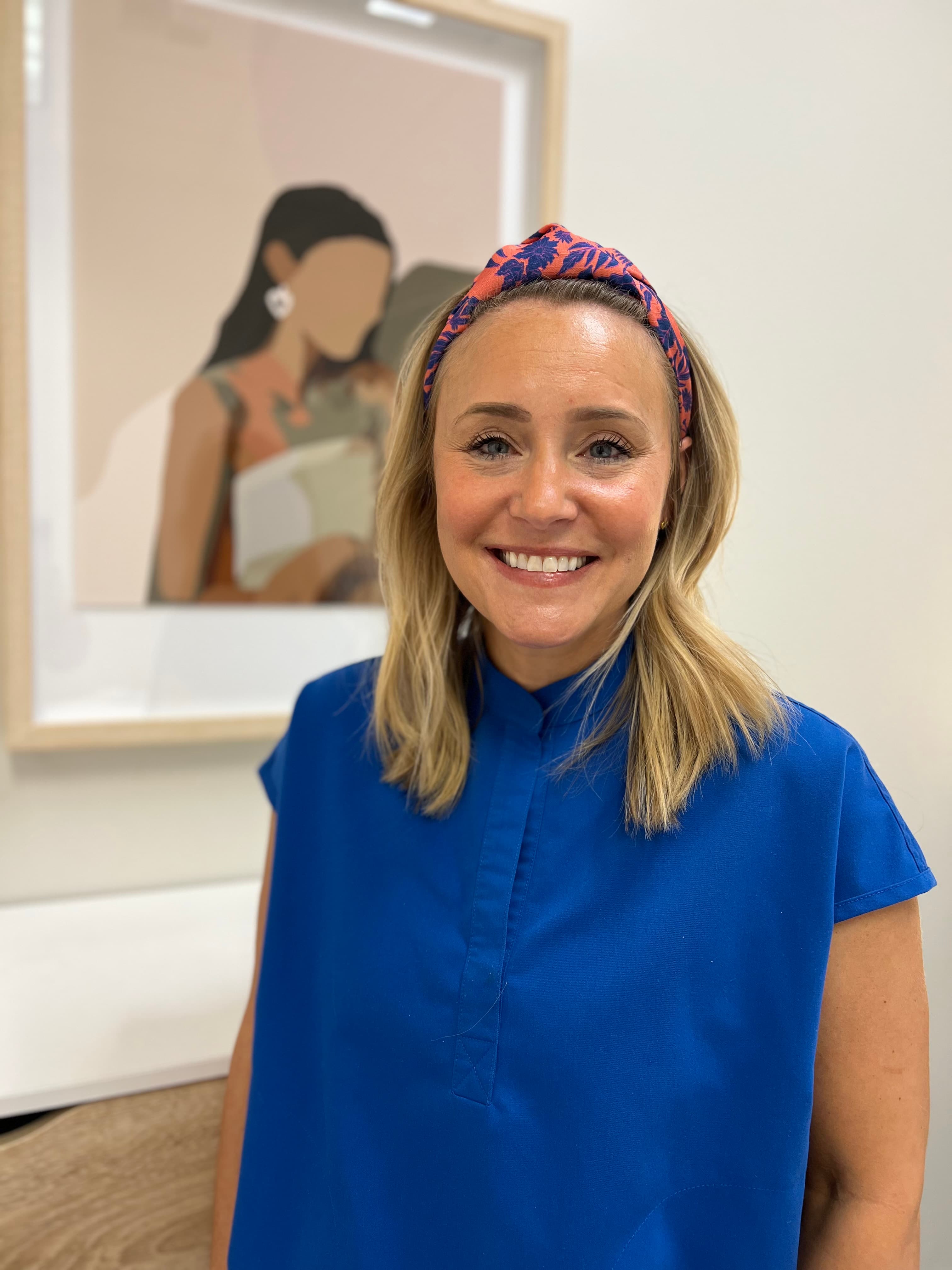 Nurse Jayme Escalona, RN, smiling warmly in her Edmonds clinic