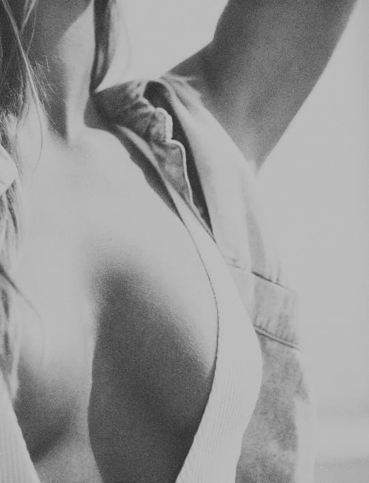 Black and white close-up of woman body, editorial style