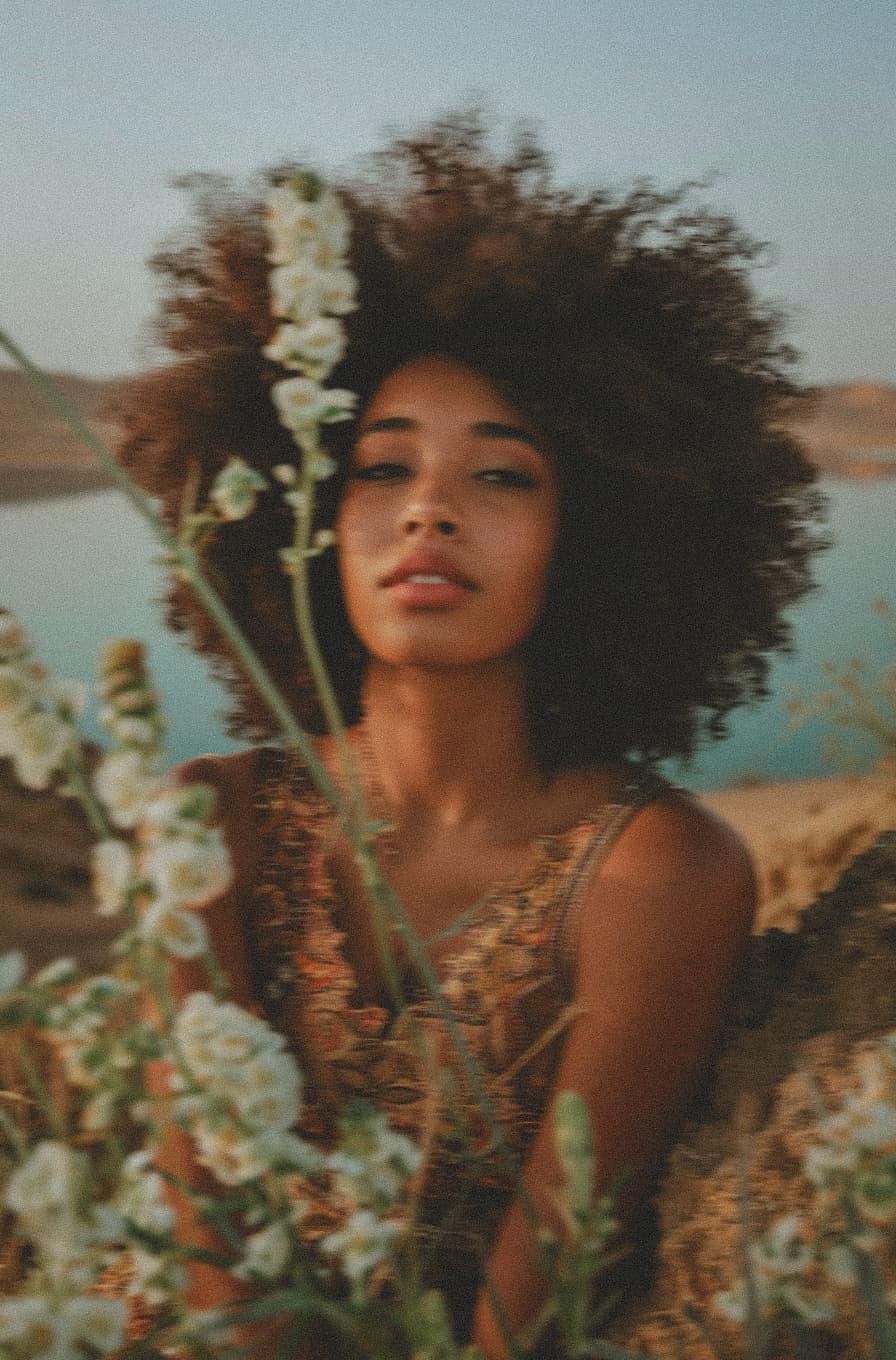 Woman among white flowers embodying natural beauty