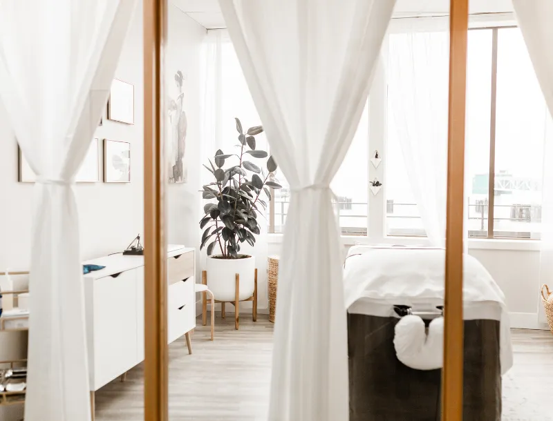 Private treatment room at Next Ov Skin with white curtains and calm atmosphere