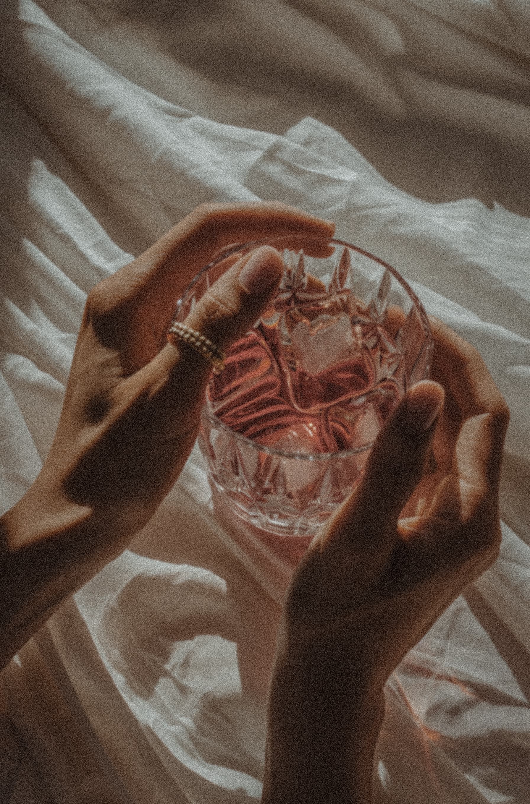 Warm golden light through crystal glass evoking vitality and clarity