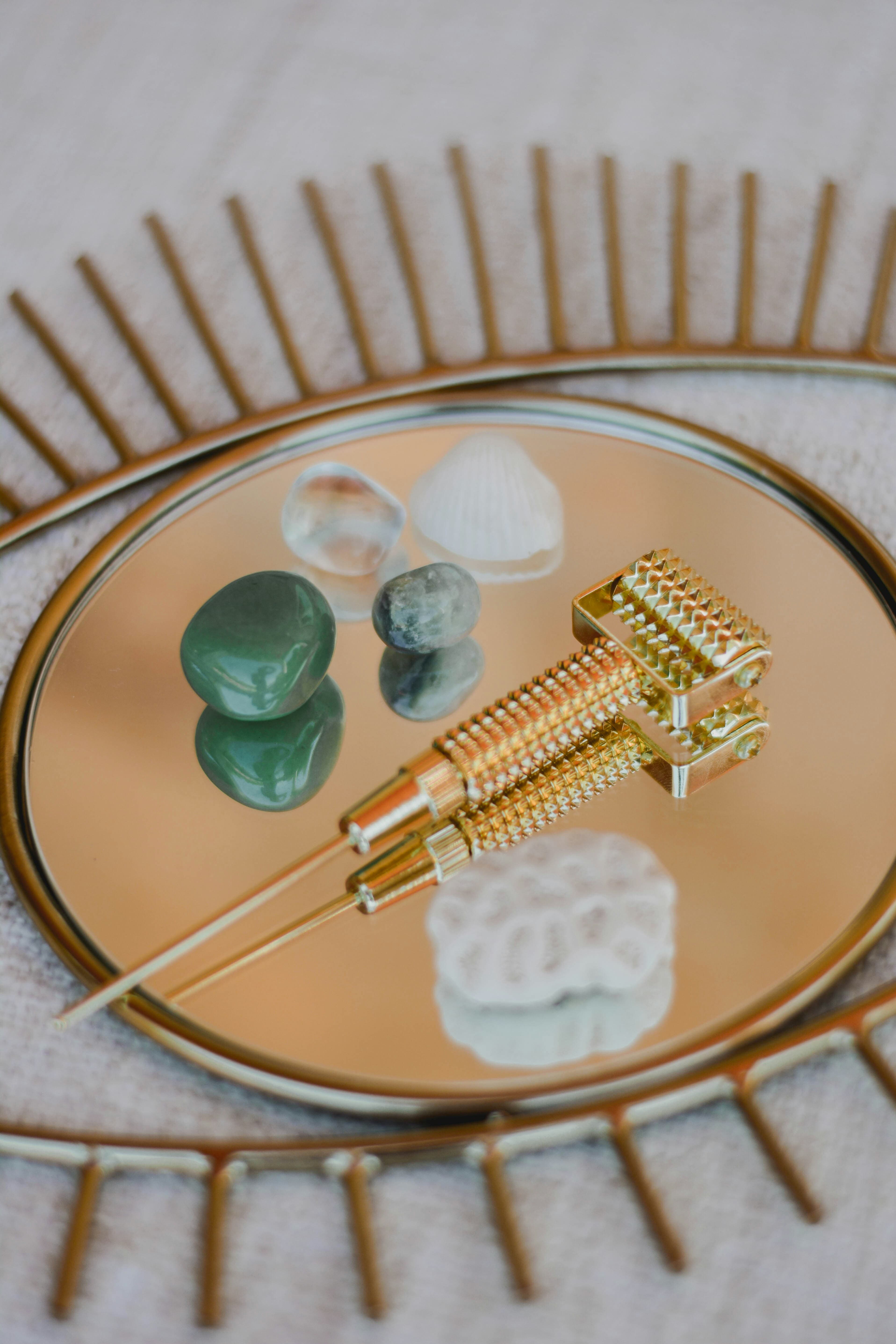 Holistic treatment tools on gold tray