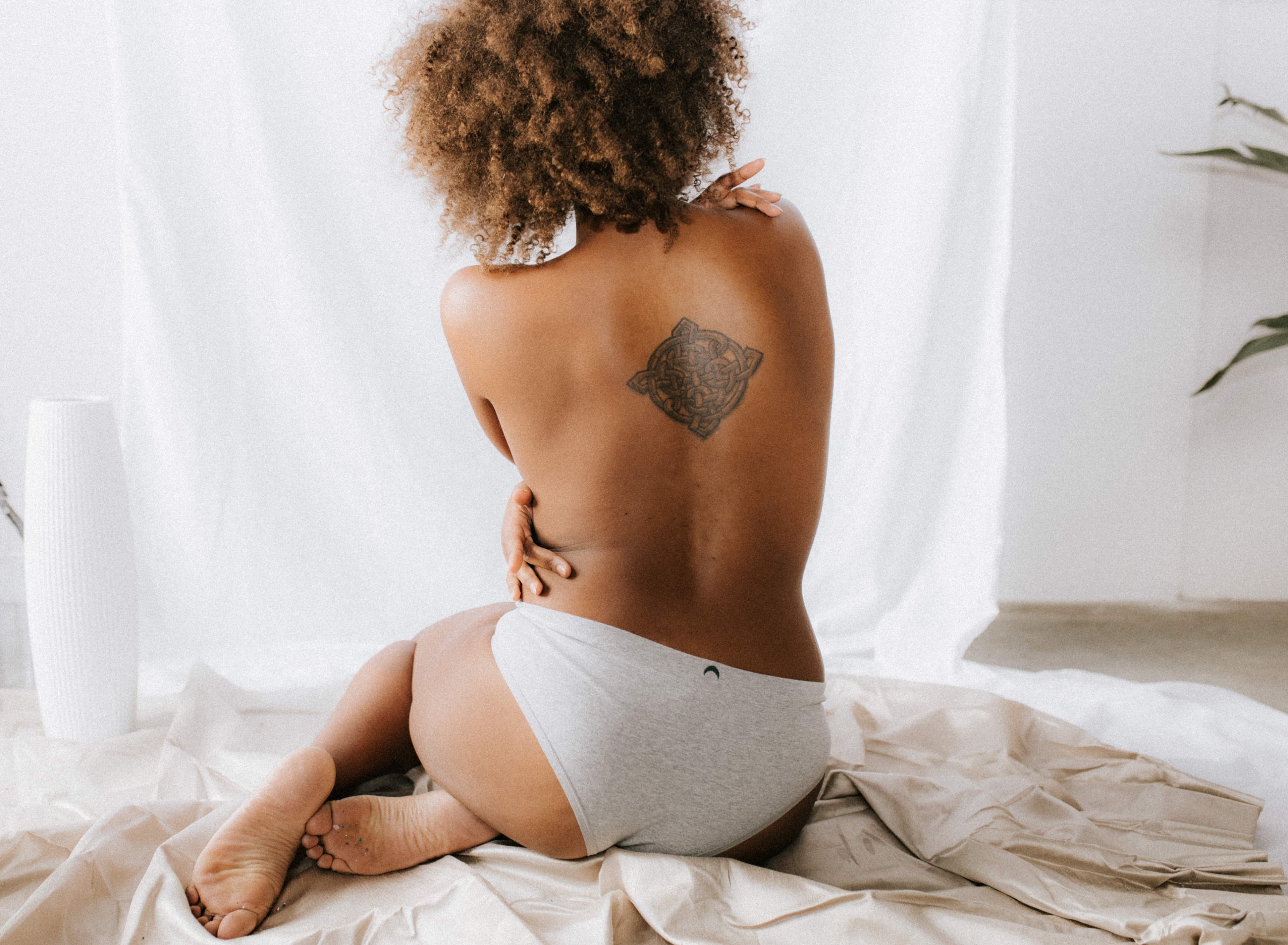 Woman feeling confident after laser tattoo removal at Next OV Skin in Edmonds, WA
