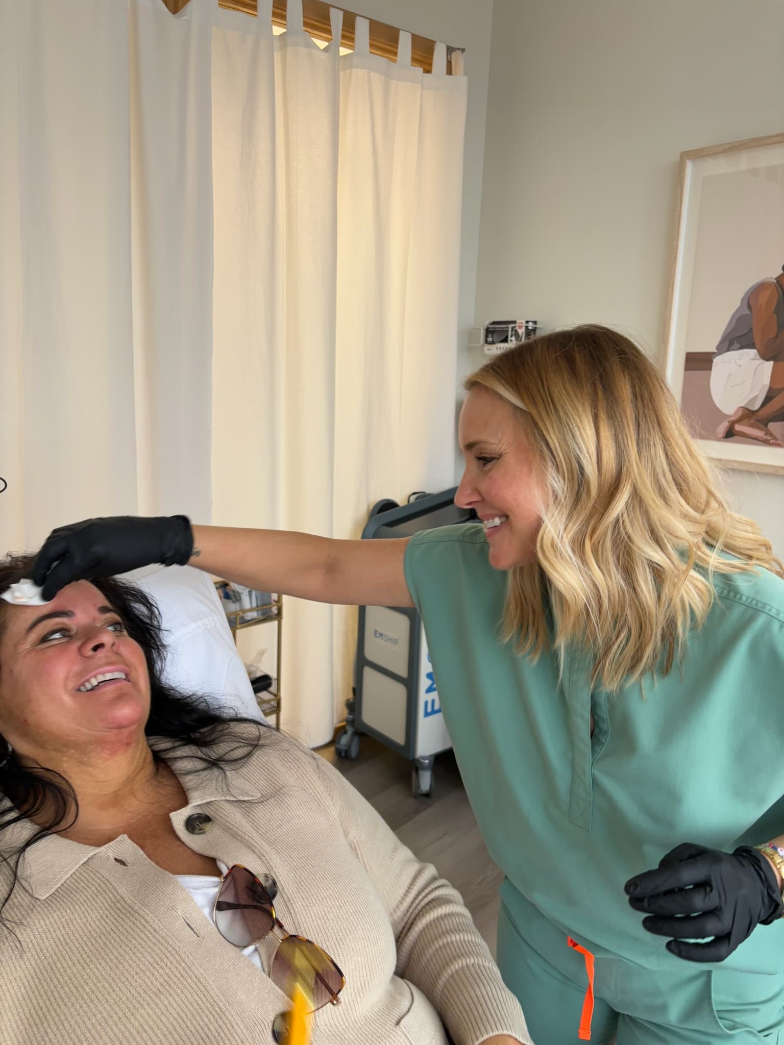 Provider applying numbing before laser tattoo removal treatment at Next OV Skin in Edmonds WA