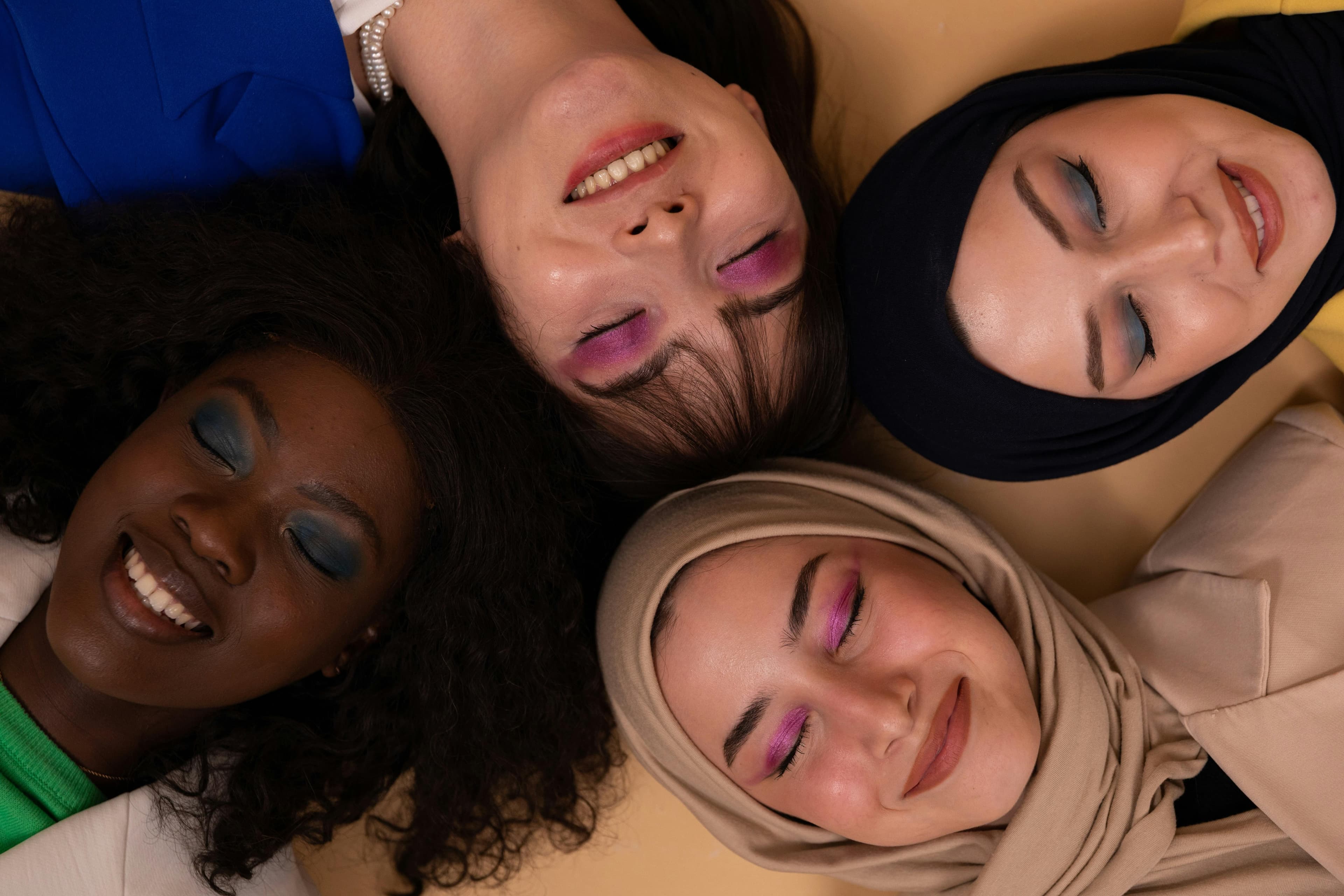 Diverse women with different skin tones representing inclusive tattoo removal care